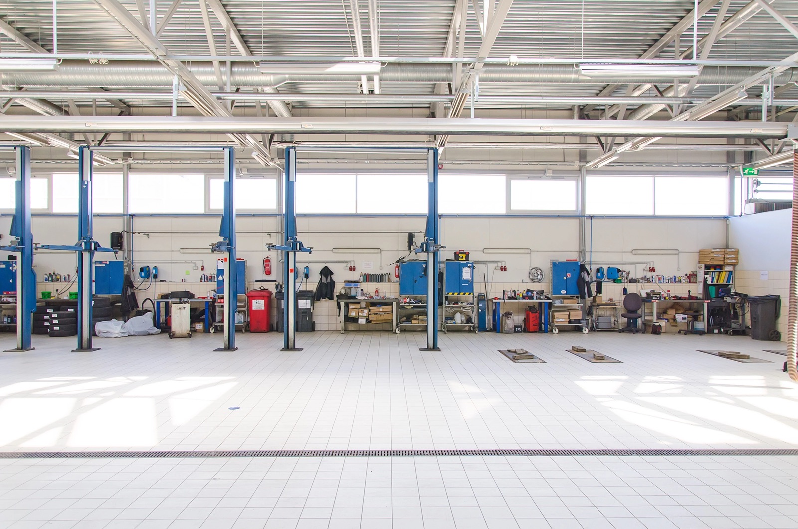 Service bays and lifts at a traditional quick-lube shop
